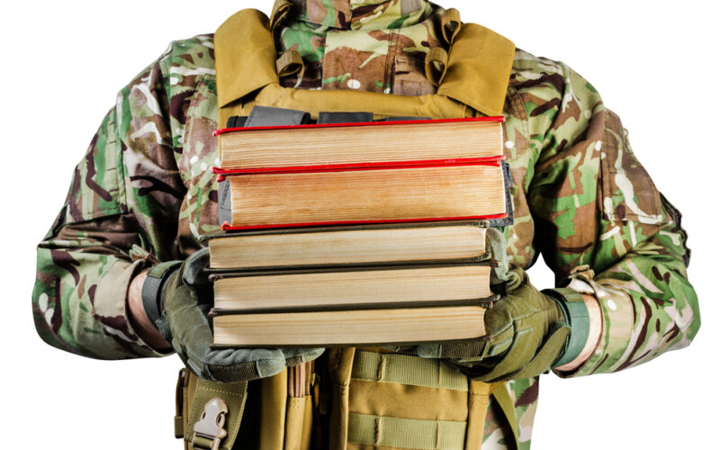 soldier holding books